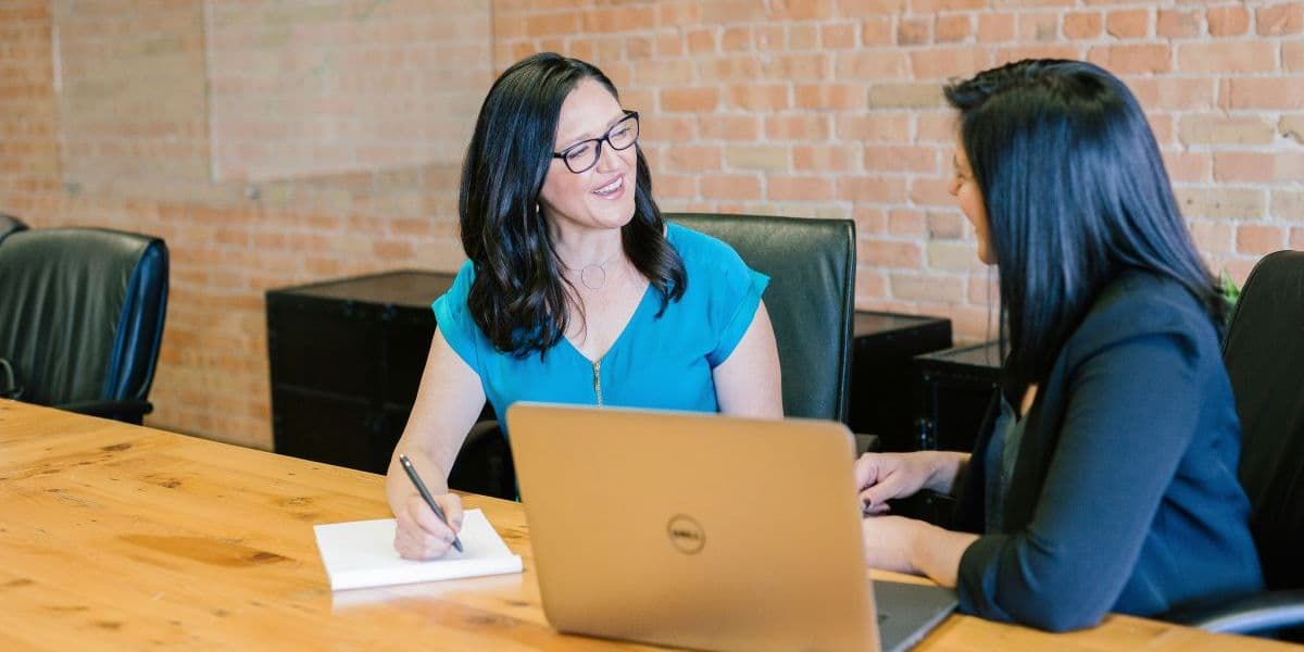 Student and instructor discussing career training and program fit.